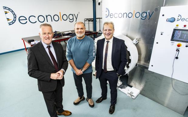 Pictured at the new LC02+ machine at Hunter Apparel Solutions are (L-R) Economy Minister Conor Murphy, CEO Simon Hunter and Jeremy Fitch, Executive Director of Business Solutions at Invest NI.  The Minister was visiting the factory to announce that the De