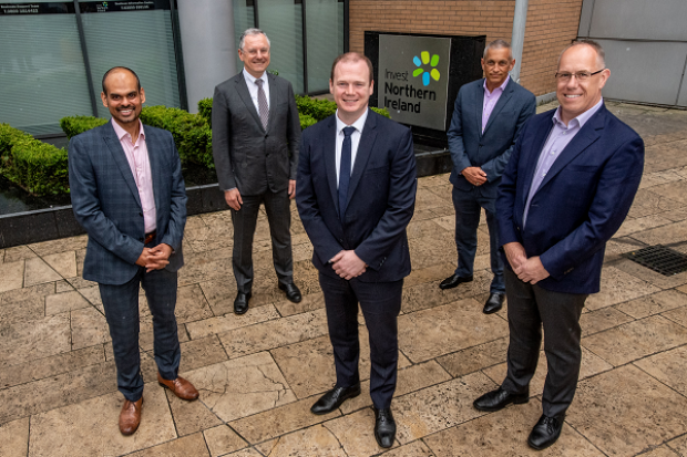 Pictured with Economy Minister Gordon Lyons (centre) are from left Thomas Raju, Belfast Site Lead, Agio; Kevin Holland, CEO, Invest NI; Ray Hillen, Managing Director - Cybersecurity, Agio and Garvin McKee, Chief Revenue Officer, Agio.